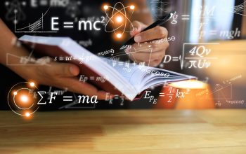 Physics,Equations,Floating,In,The,Background,,Hands,Writing,In,Notebooks